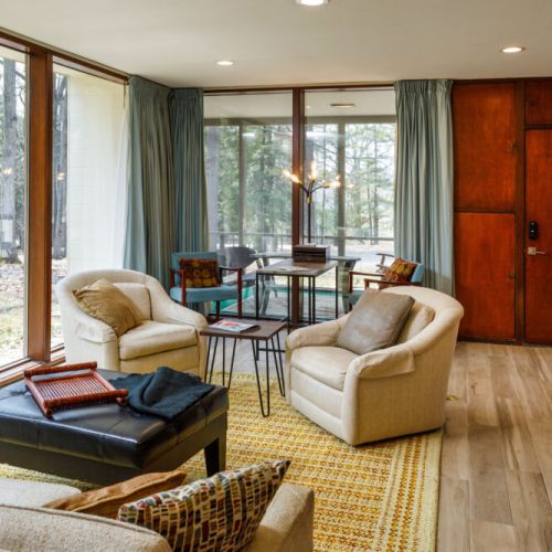 Relax and unwind with stunning floor-to-ceiling wooded-views from the cozy comfort of this unique mid-century modern stay.