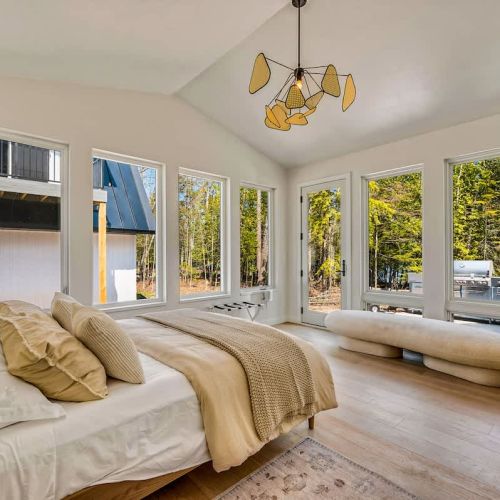 Off the main living area, you'll find the first bedroom that features incredible floor-to-ceiling windows and a plush Queen-sized bed.