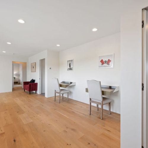 Thoughtfully designed for today's lifestyle, the hallway features two compact desks ideal for remote work, study, or quick laptop use.