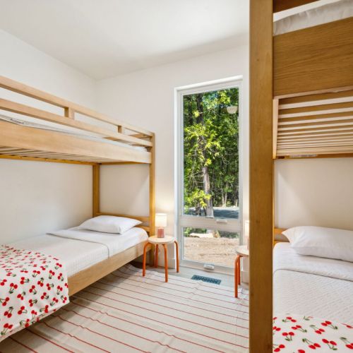 Featuring two twin-over-twin bunks and playful bedding, the third bedroom is perfect for younger guests or groups of friends.
