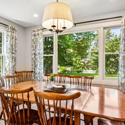 Our dining table overlooks our beautiful backyard.