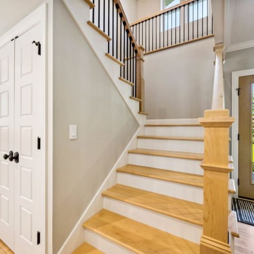 There's plenty of pantry storage for your groceries under our new, beautiful staircase right off the kitchen.
