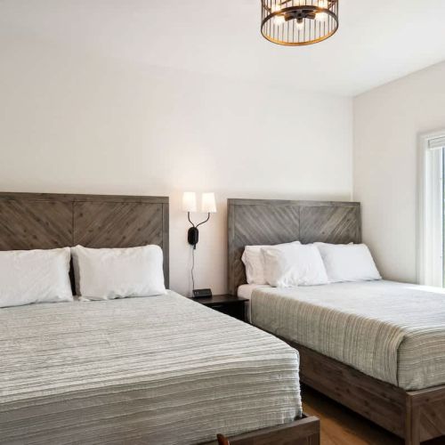 The second bedroom includes two queen beds, ideal for couples or teens.