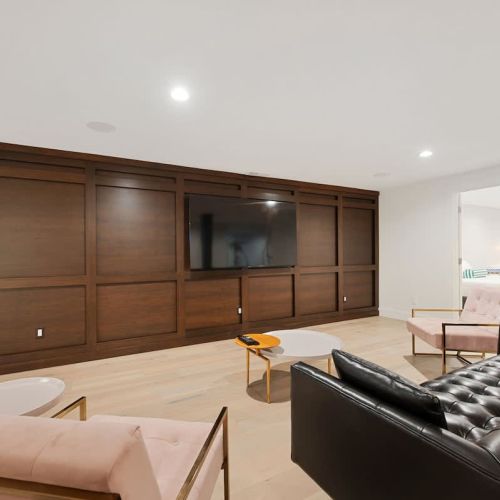 A spacious secondary living and entertainment area offers the perfect setting for the group to unwind with films, series, or shared screen time.