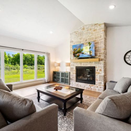 Relax in a clean and comfortable living area with peaceful orchard views just outside your window.