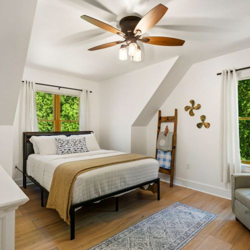 One bedroom features a comfortable queen bed and TV