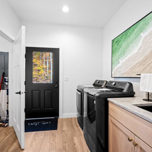 The dedicated laundry area adds convenience and comfort, allowing guests to easily refresh their belongings throughout their stay.