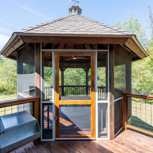 Enjoy a bug-free night in Door County while lounging on the Adirondack chairs in the screened gazebo.