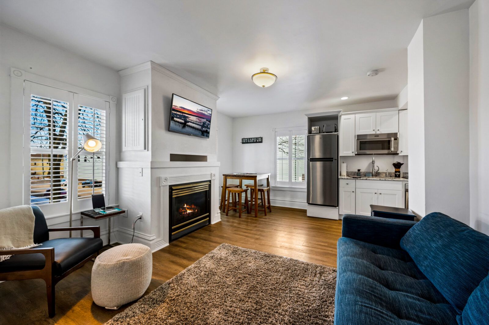 The living room features a gas fireplace and queen-sized sleeper sofa.