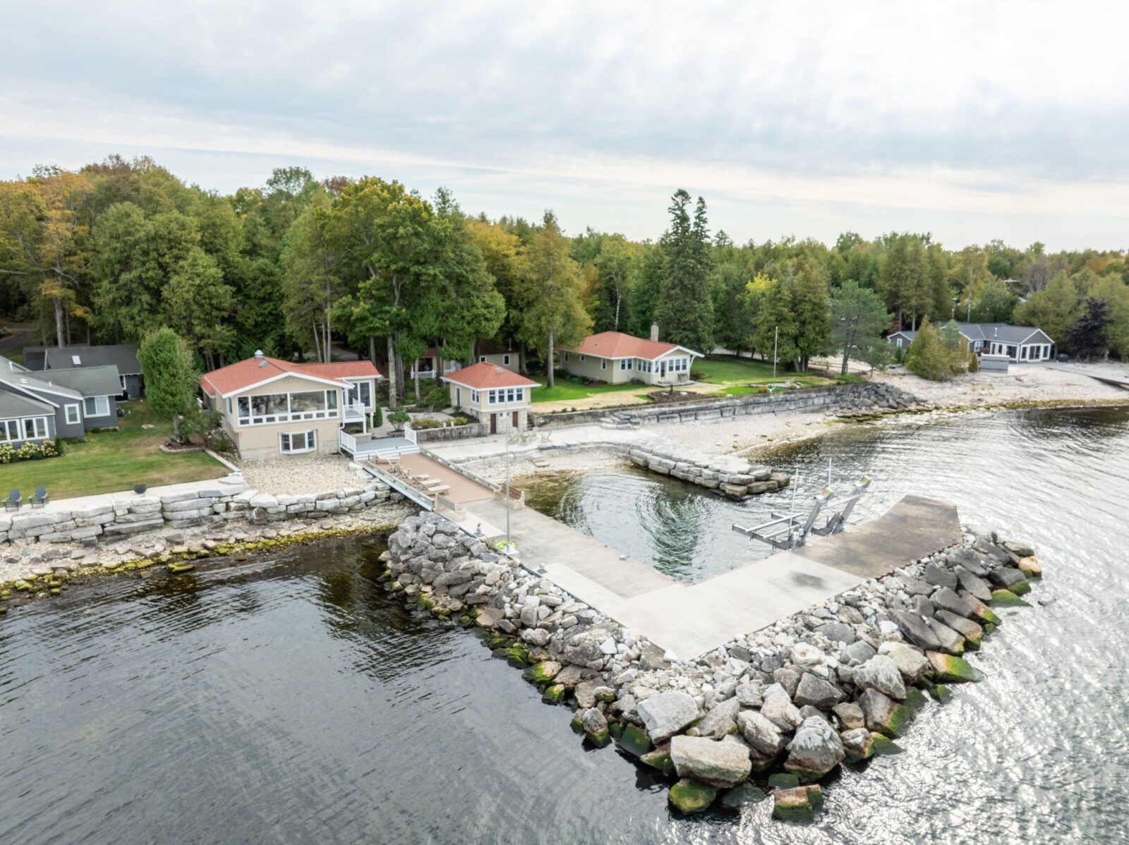 Discover the ultimate group getaway at Three Leaves Bayside Retreat in Egg Harbor, Wisconsin. Perfect for large families and reunions, this unique property features four charming cabins, a communal kitchen and mess hall, sauna and stunning waterfront views.